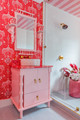 Custom Belle de Nuit linen and vinyl wallpaper, fabric-draped countertops and curtains, and Hudson Stripe vinyl ceiling in the “De-Loo-Loo” bathroom by Megan Gorelick Interiors for Kips Bay Decorator Show House Palm Beach. Photography by Venijhamin Reyes.